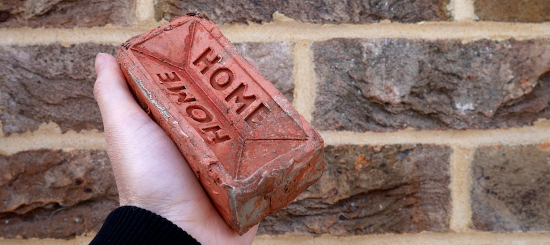 Image of brick in hand